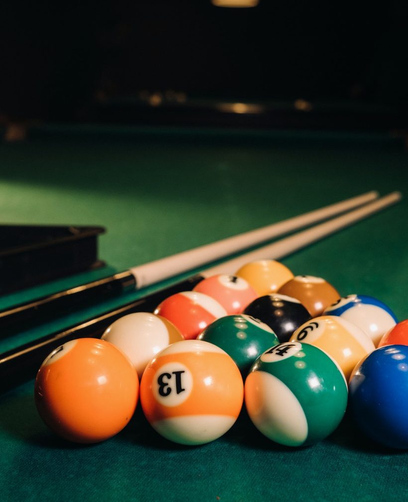 billiard-table-with-green-surface-and-balls-in-the-billiard-club-pool-game-2.jpg